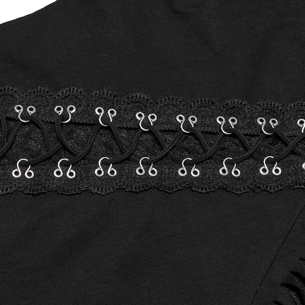 Close-up of textured black mesh fabric with decorative metal hooks on asymmetrical punk sweatshirt.