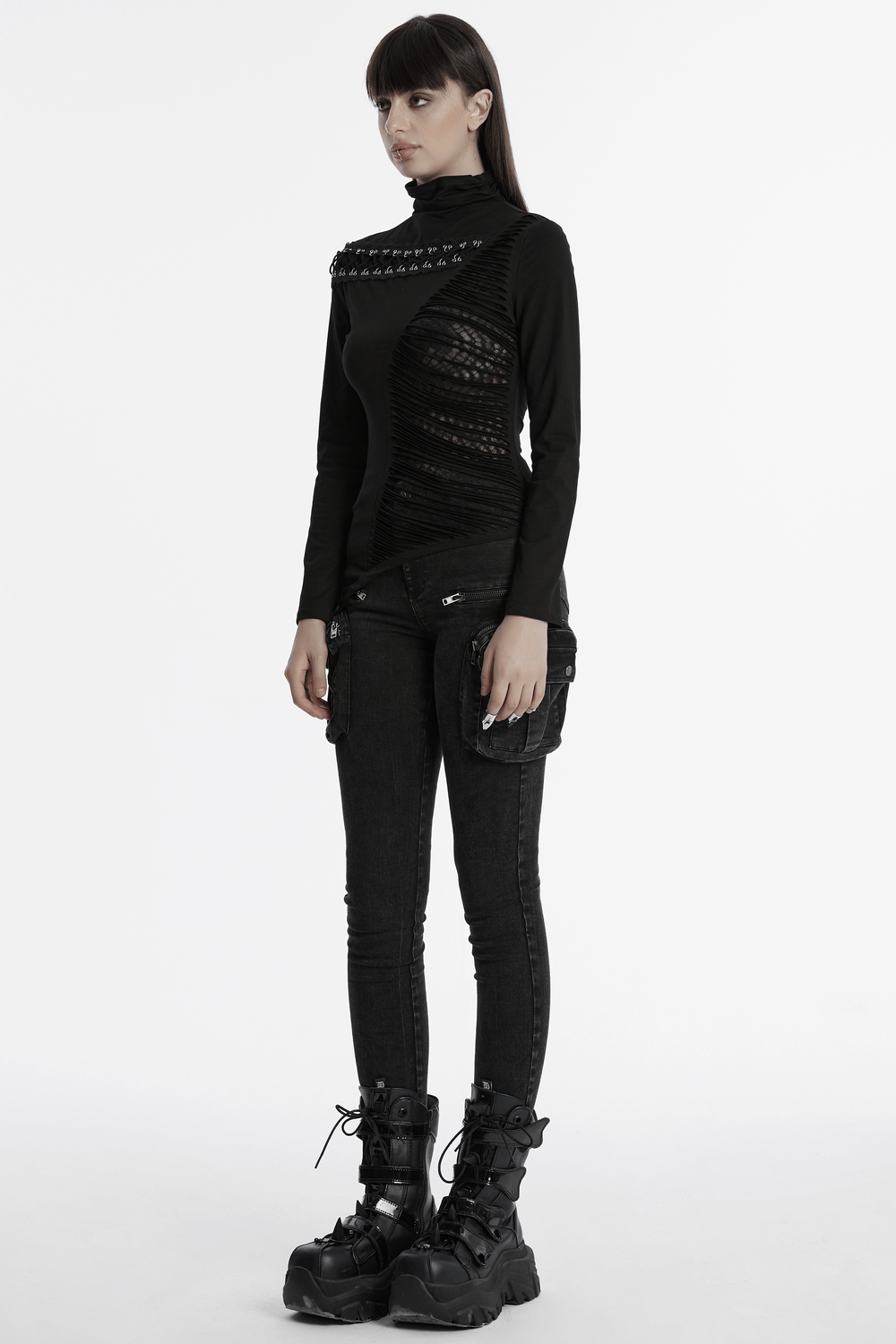 Asymmetrical punk mesh sweatshirt featuring unique buckle and zipper, styled with edgy black skinny jeans.