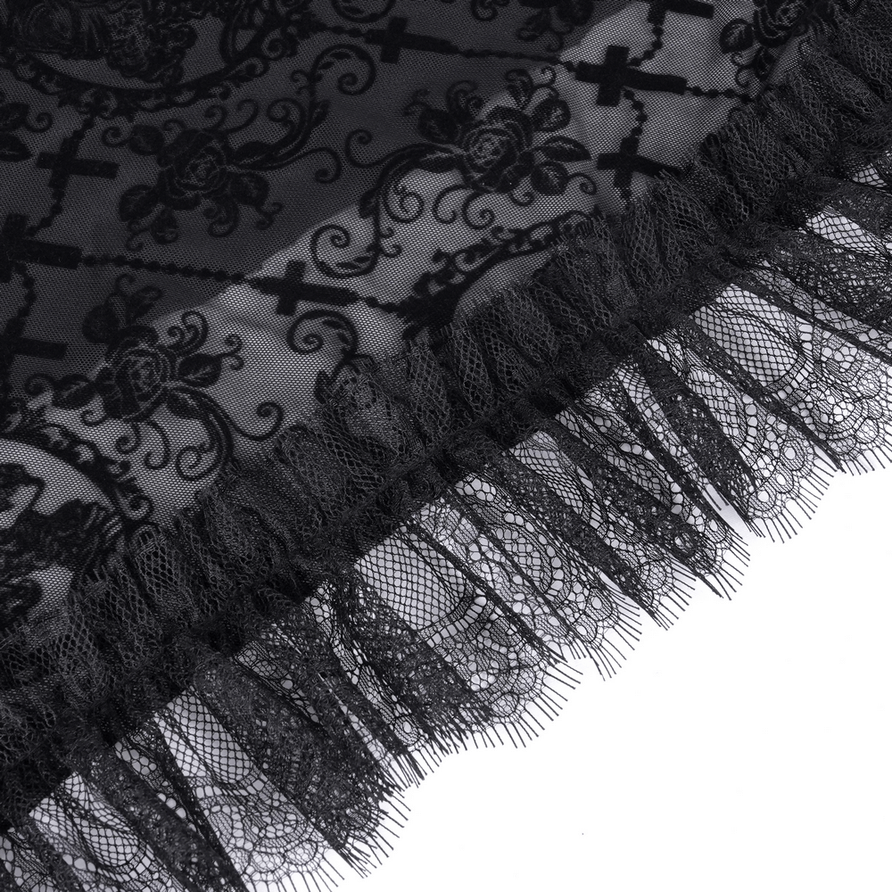Close-up of intricate lace fabric with gothic cross patterns and ruffled edges for a striking asymmetrical skirt.