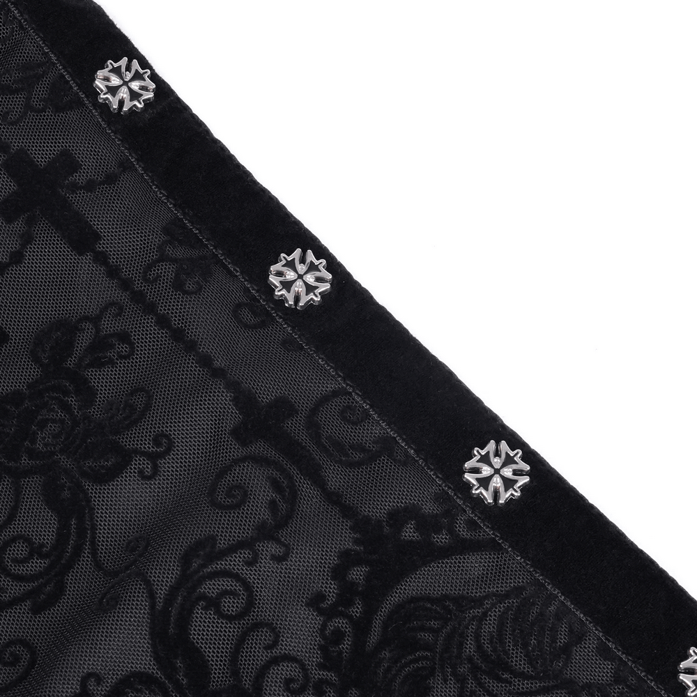 Close-up of intricate lace patterns and ornate buttons on an asymmetrical gothic skirt.