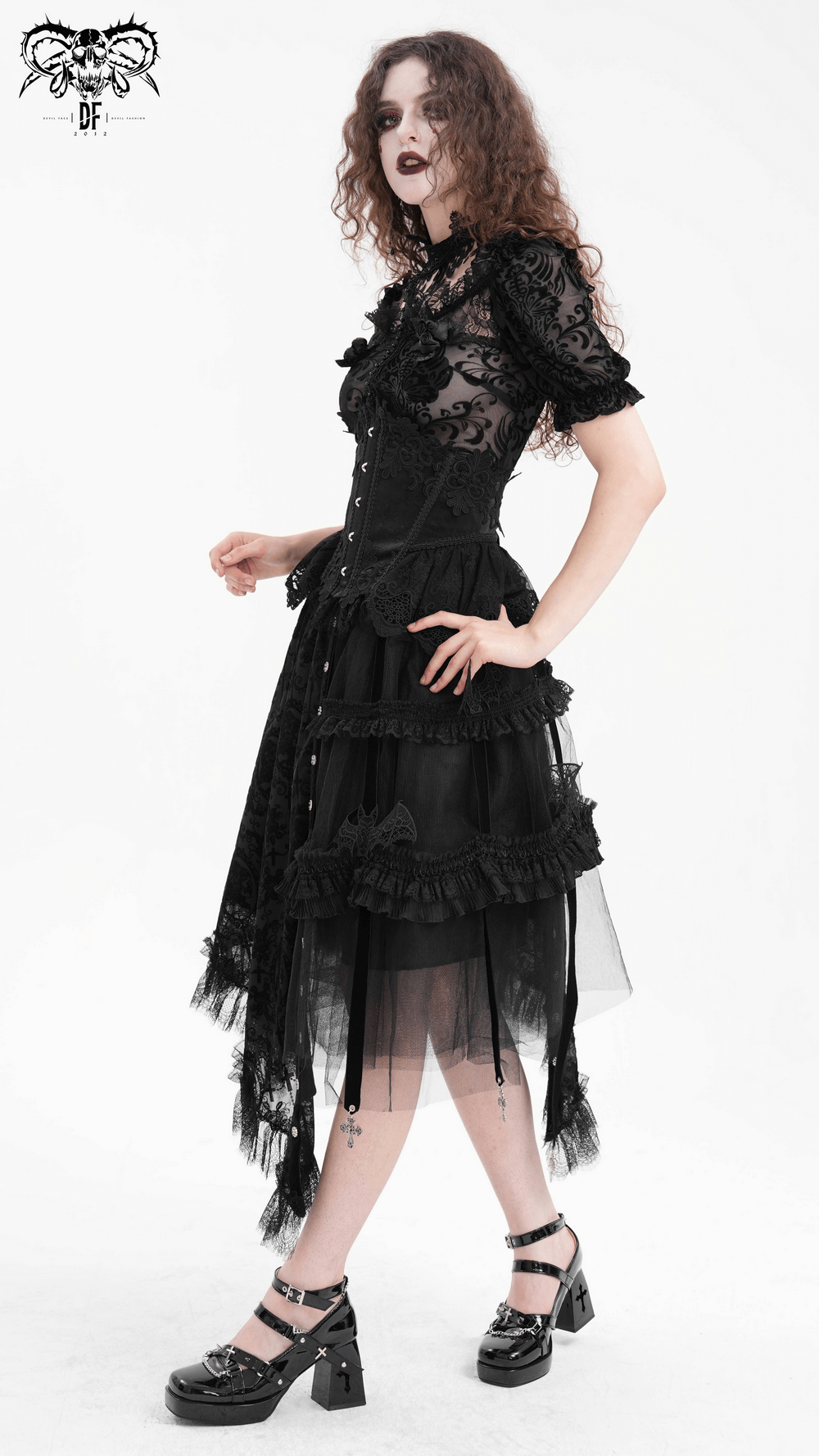 Gothic asymmetrical skirt featuring bat wing accents, lace patterns, and cross charms for a dramatic look.