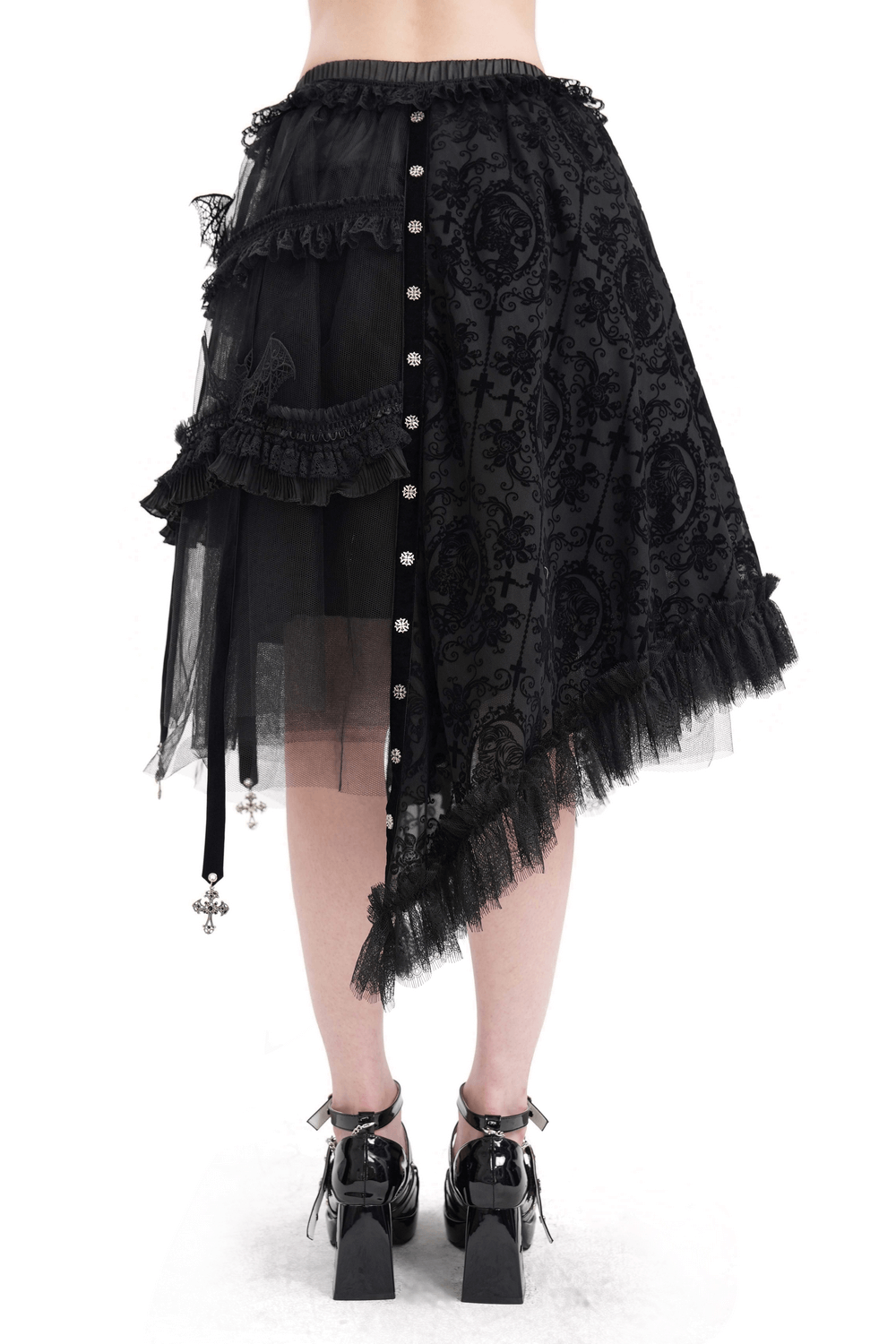 Asymmetrical black gothic skirt with bat wing accents, lace patterns, and cross charms, showcasing elegant ruffles and buttons.
