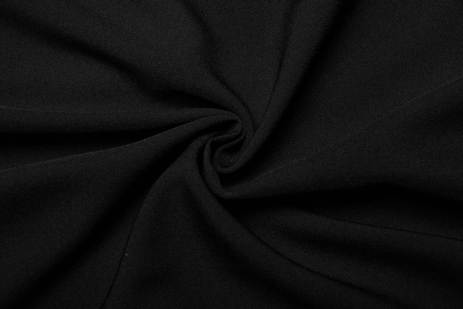 Close-up of black twill woven fabric, showcasing its smooth texture and durability for fashion-forward designs.