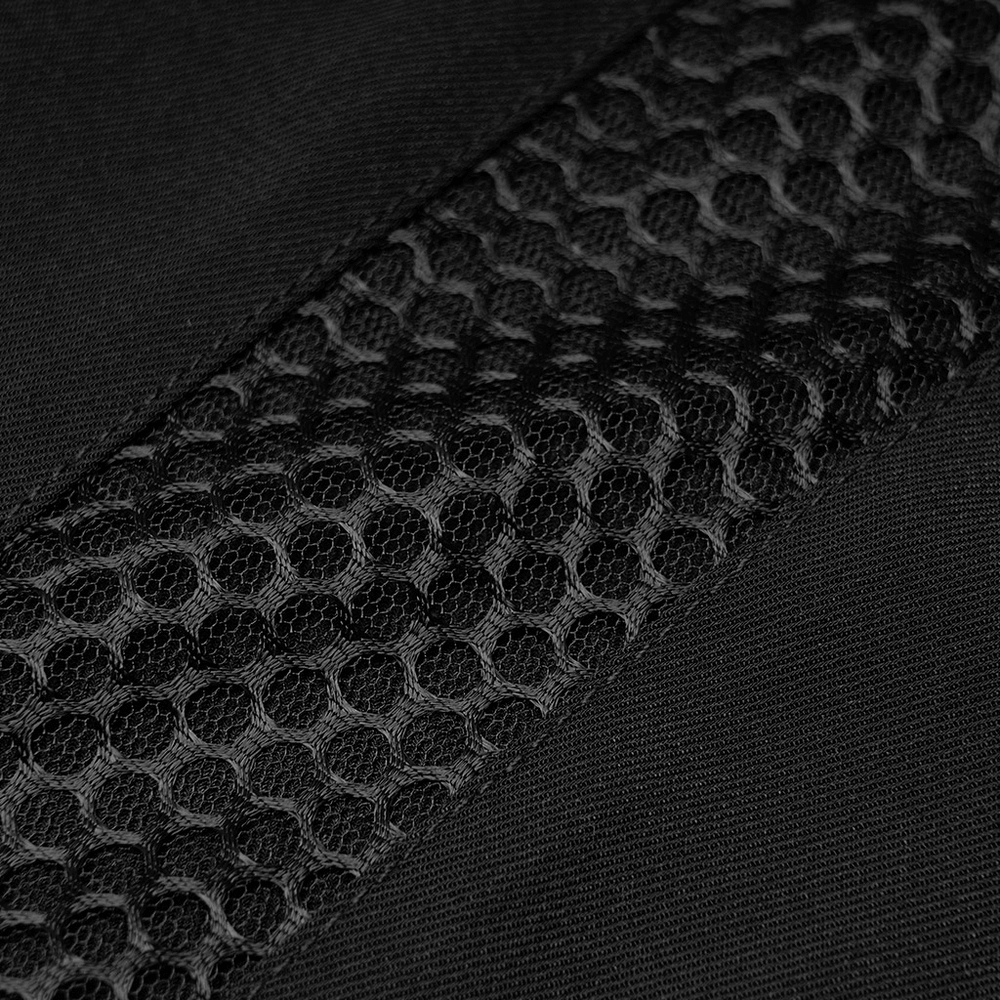 Close-up of black fabric with mesh accents, showcasing stylish texture and design details.
