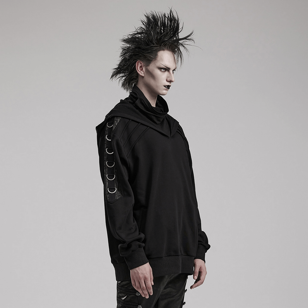 Avant-Garde black hoodie with faux leather details and D-ring accents worn by a model with punk hairstyle.