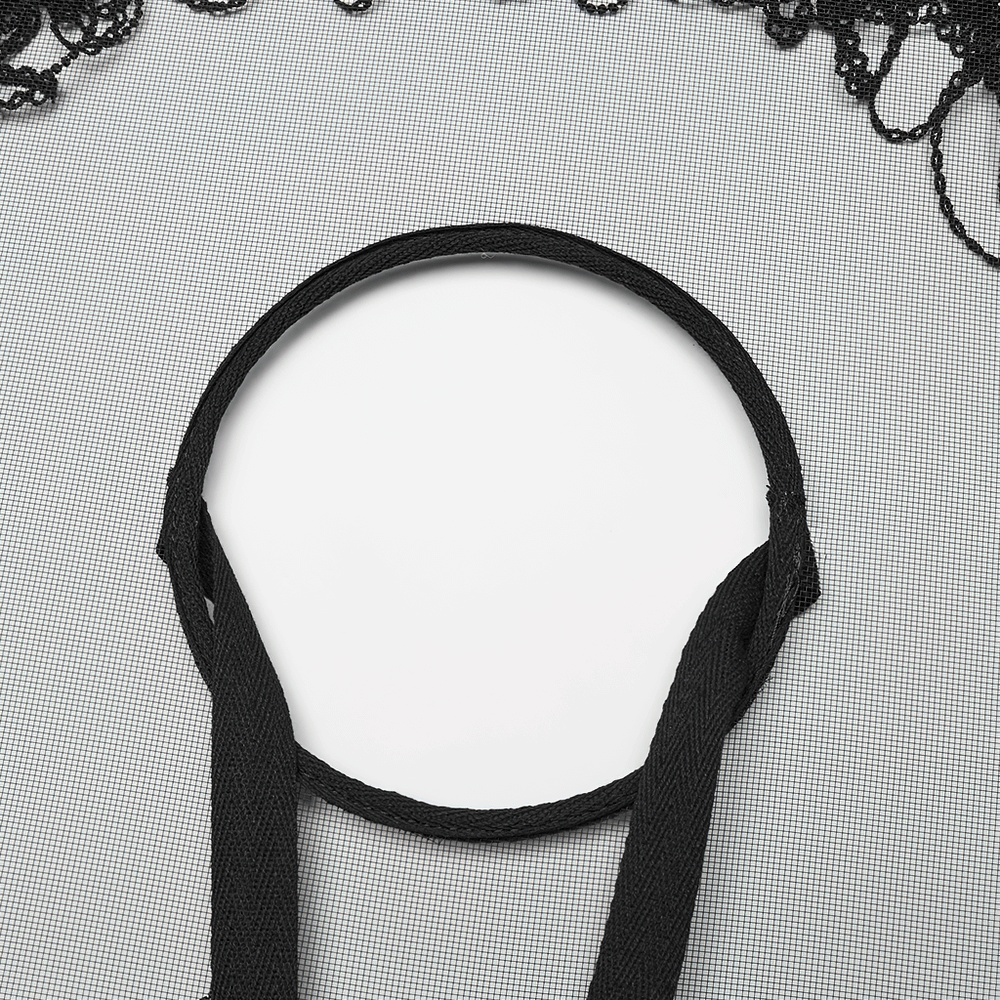 Close-up of the adjustable ribbon of a bamboo mesh hat with tassel accents, highlighting its stylish design.