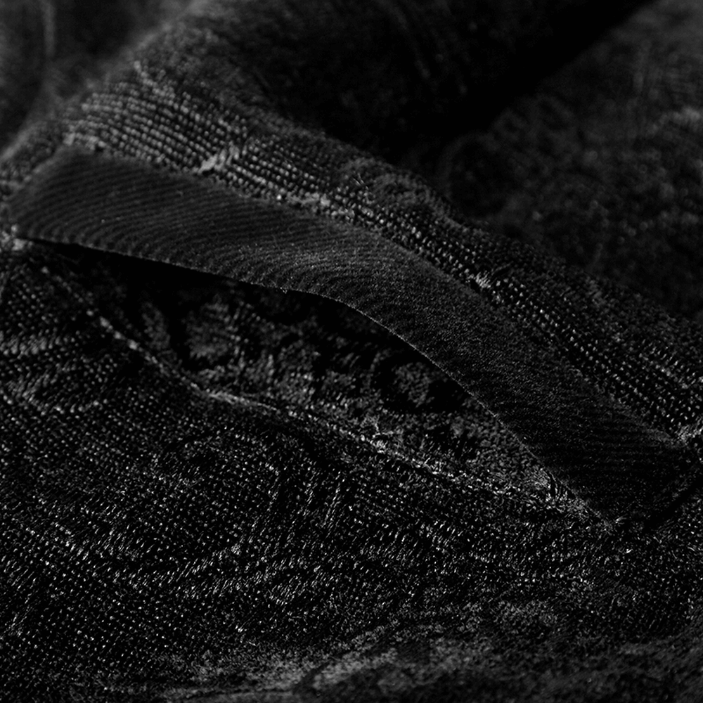 Close-up of luxurious black jacquard fabric showcasing intricate patterns, perfect for steampunk fashion.