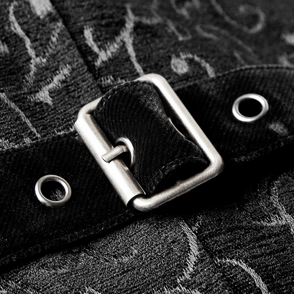 Close-up of a silver buckle on a black jacquard steampunk waistcoat, showcasing intricate fabric details.