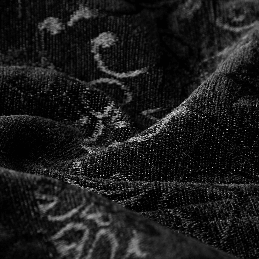 Close-up of luxurious black jacquard fabric showcasing intricate vintage patterns for steampunk designs.
