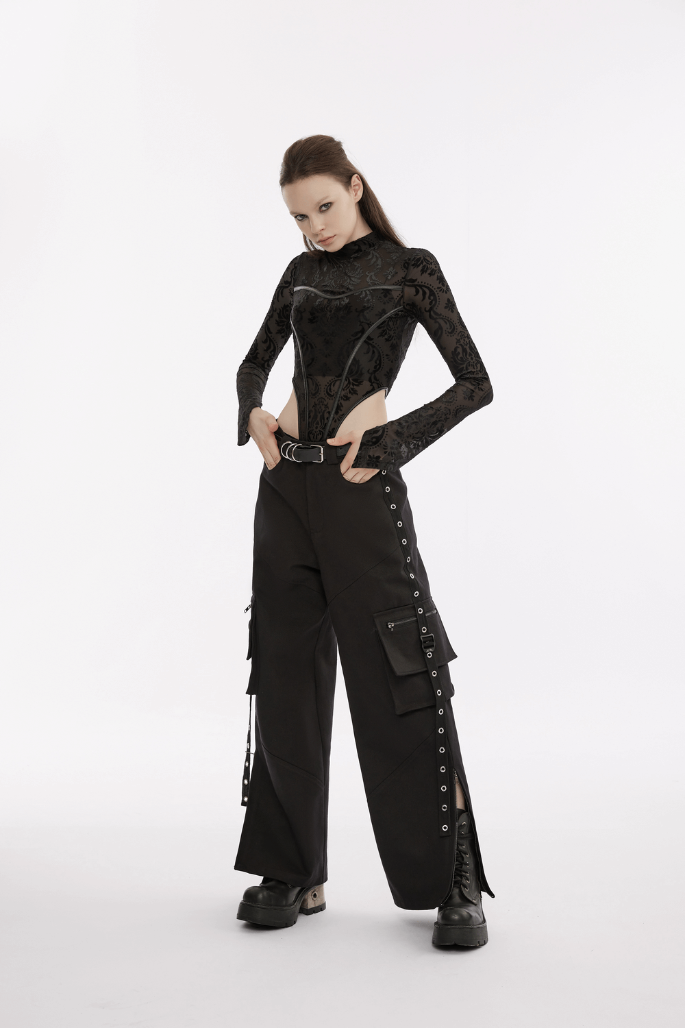 Model wearing a Baroque Flocked Gauze Bodysuit with Gothic Sleeves and stylish black pants.