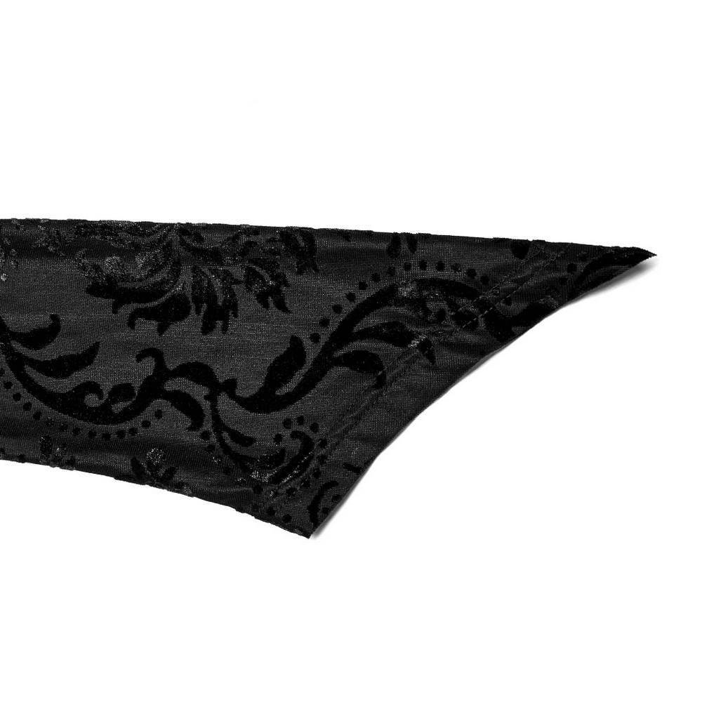 Close-up of the Gothic pointed sleeve in ornate black flocked fabric, showcasing intricate design details.