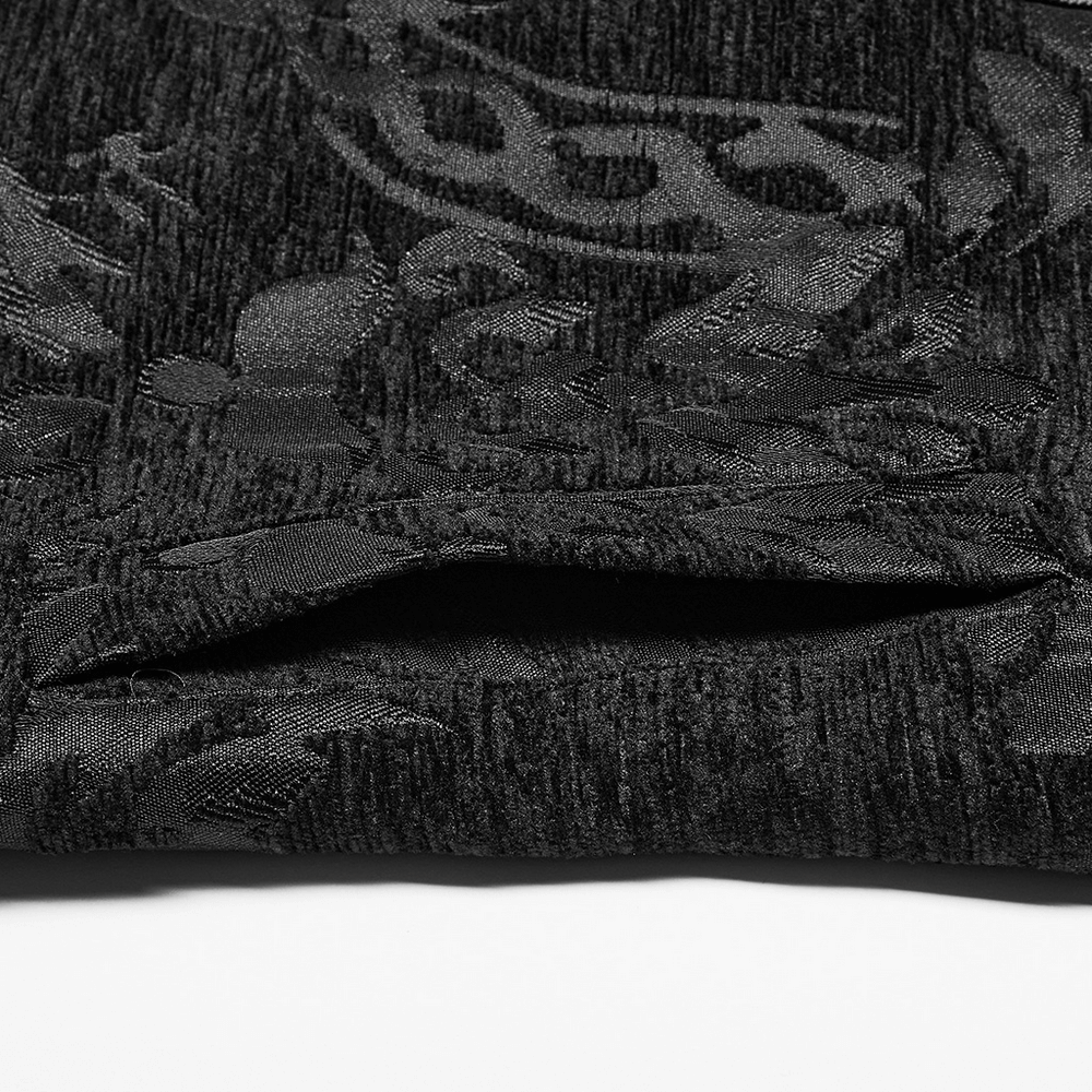 Close-up of textured black fabric with Baroque Gothic pattern for waistcoat detailing.