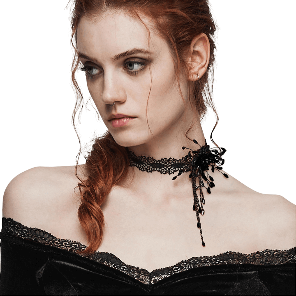 Gothic beaded spiderweb choker with blood drop accents, elegantly worn by a model with red hair.