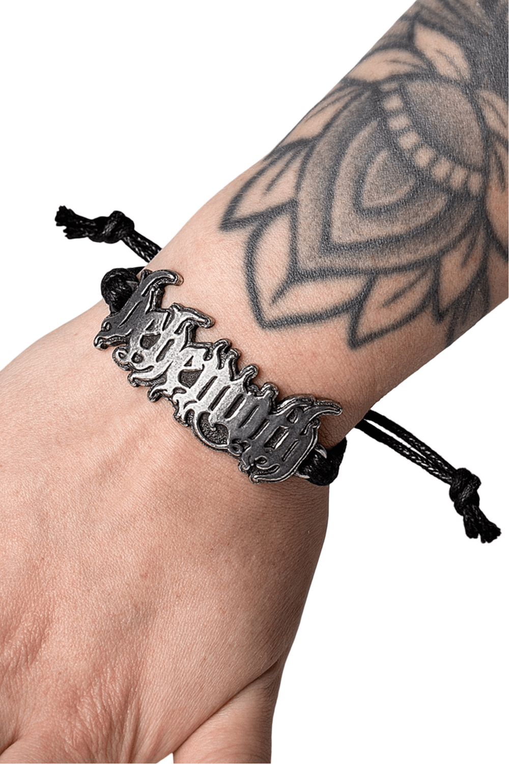 Behemoth logo bracelet on adjustable black cord, showcasing unique pewter detail and wrist tattoo.