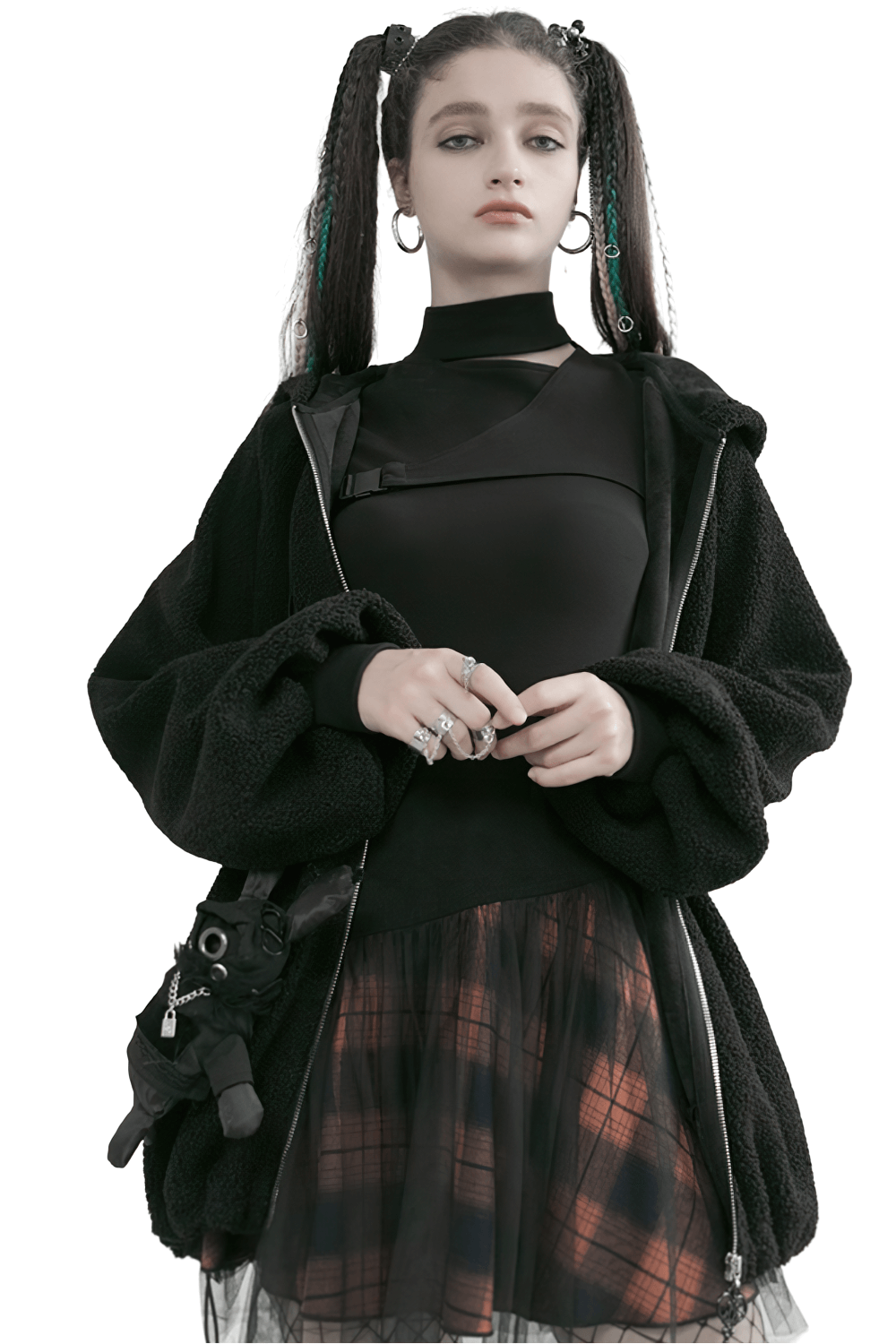 Trendy model in a black oversized jacket, highlighting a layered plaid mesh skirt with punk elements.