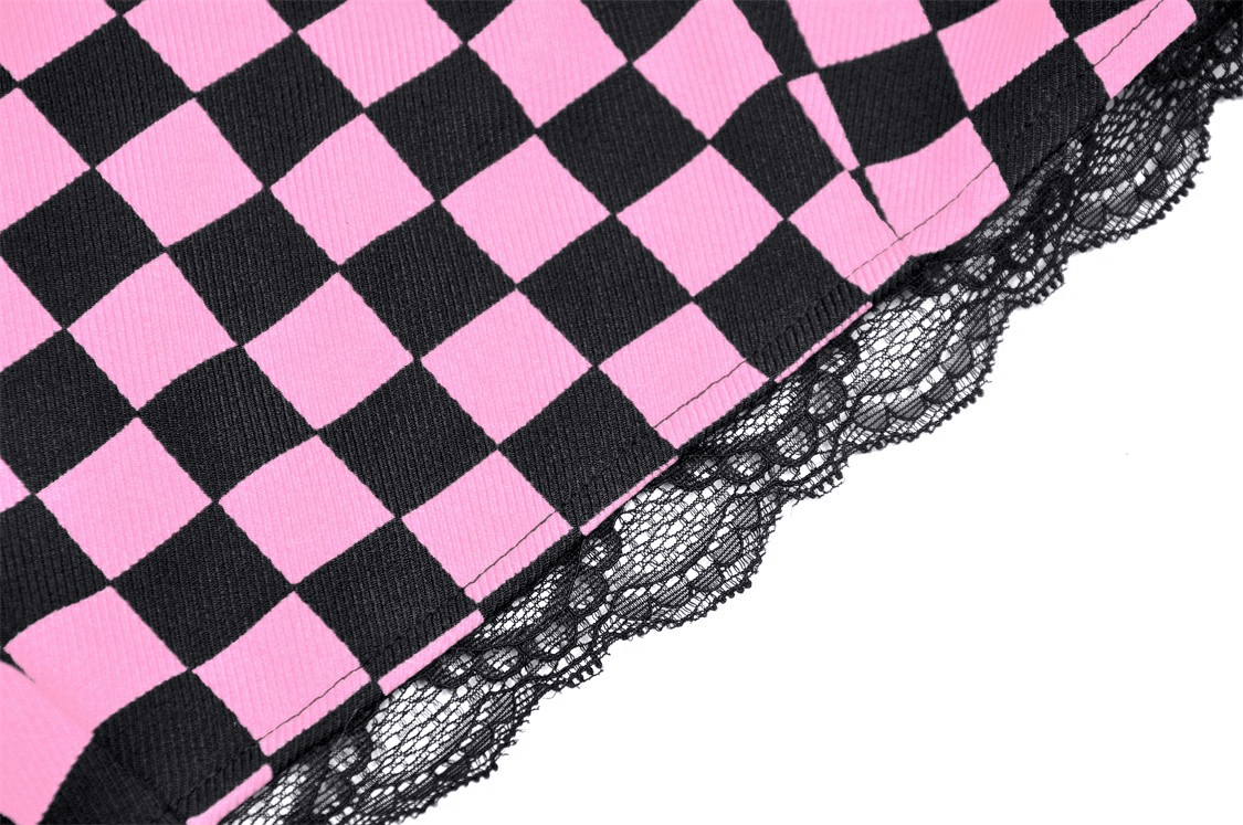 Close-up of black and pink checkered fabric with lace trim, perfect for a punk rock halter crop top.