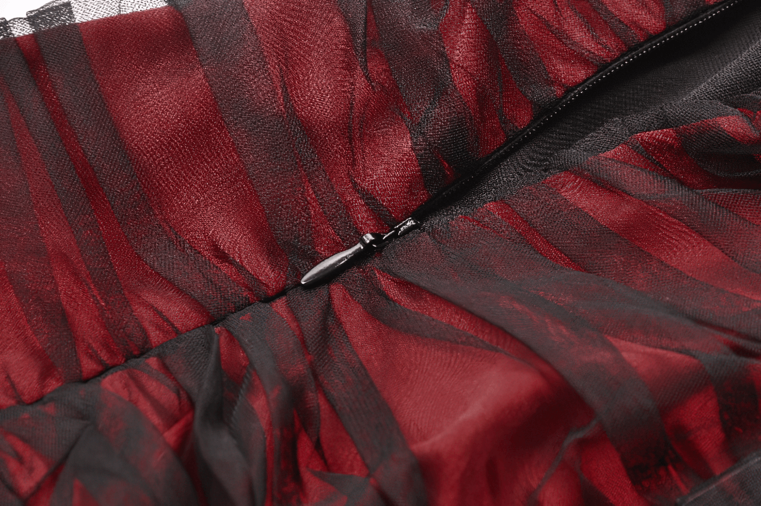 Close-up of the sheer black and red fabric detailing of a gothic maxi dress, showcasing intricate patterns and zip closure.