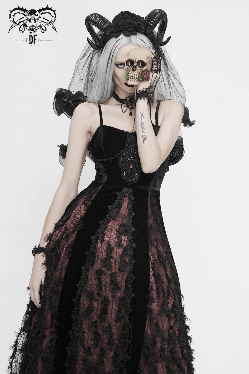 Gothic velvet long dress in black and red, featuring lace details and a model holding a skull, embodying elegant dark fashion.