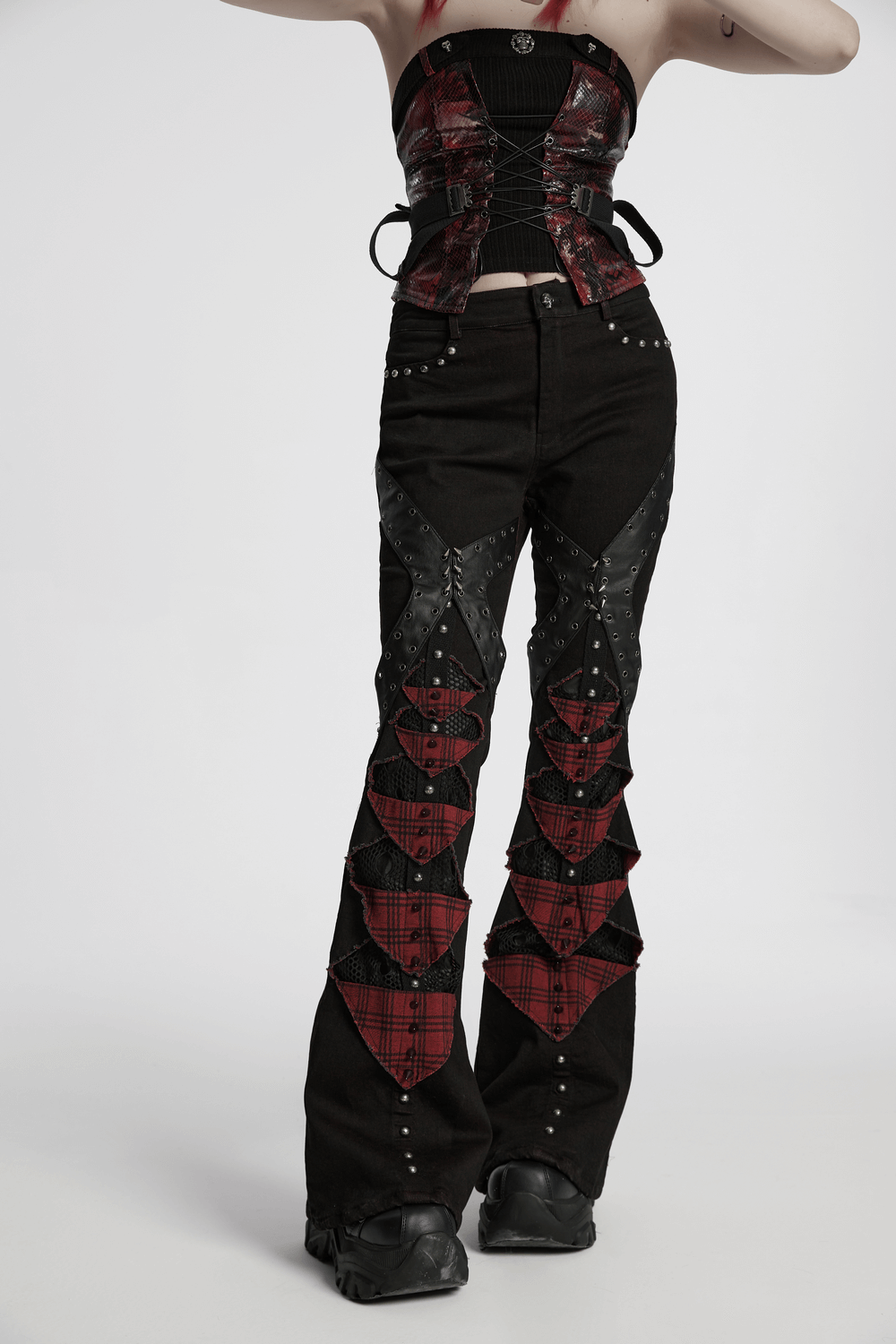 Black and red plaid gothic flared pants with studs, featuring punk mesh panels and a bold design.