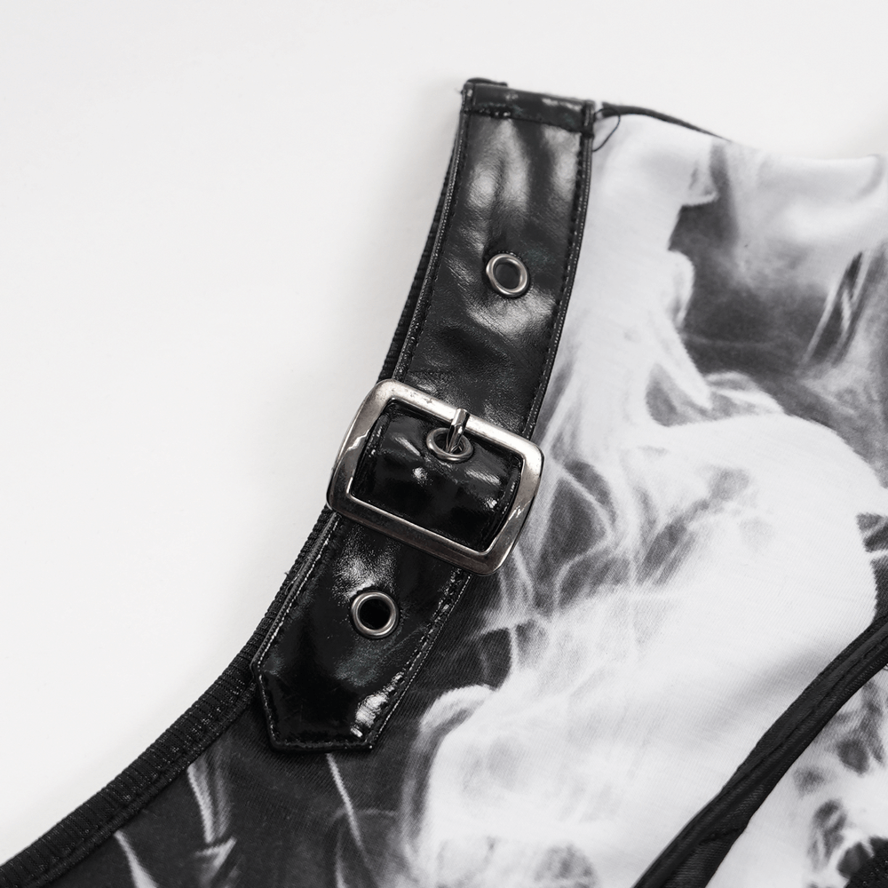 Close-up of black and white gothic dress strap with faux leather buckle and smoky web print details.