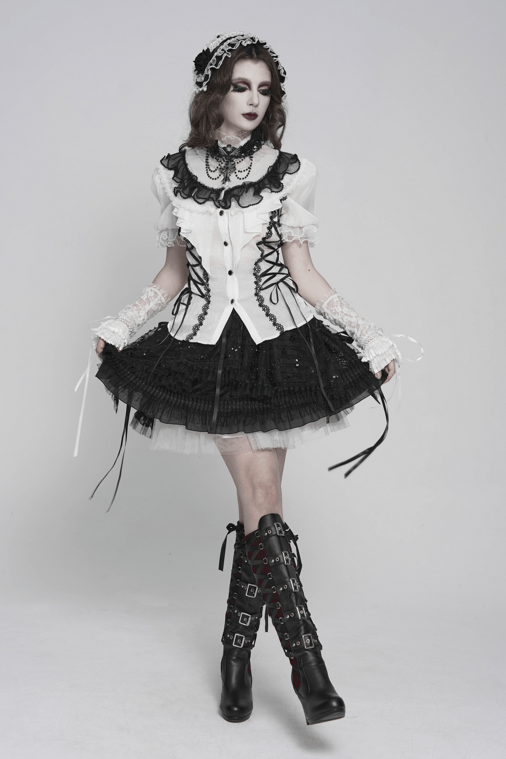 Black and White Gothic Lolita Lace Bonnet with Roses worn with a Victorian-inspired outfit featuring ruffled layers and lace.