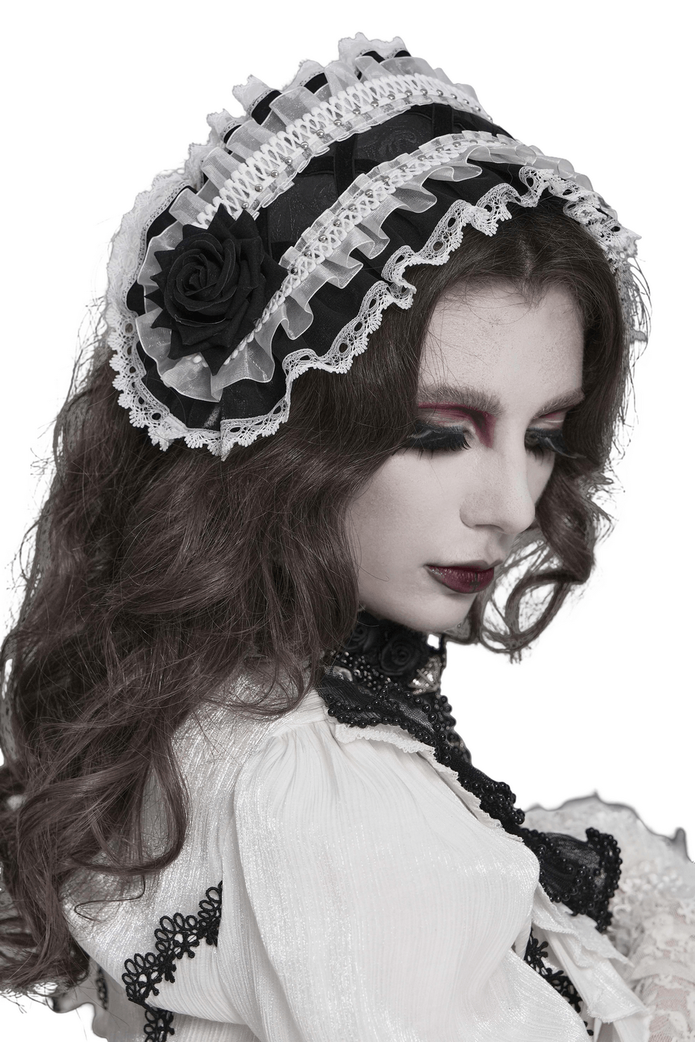 Black and White Gothic Lolita Lace Bonnet with Roses worn elegantly, showcasing intricate lace and black rose accents.