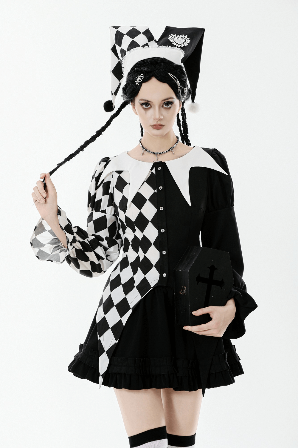 Black and White Harlequin Jester Hat with Lace Trim worn by a model with braided hair and checkered dress.
