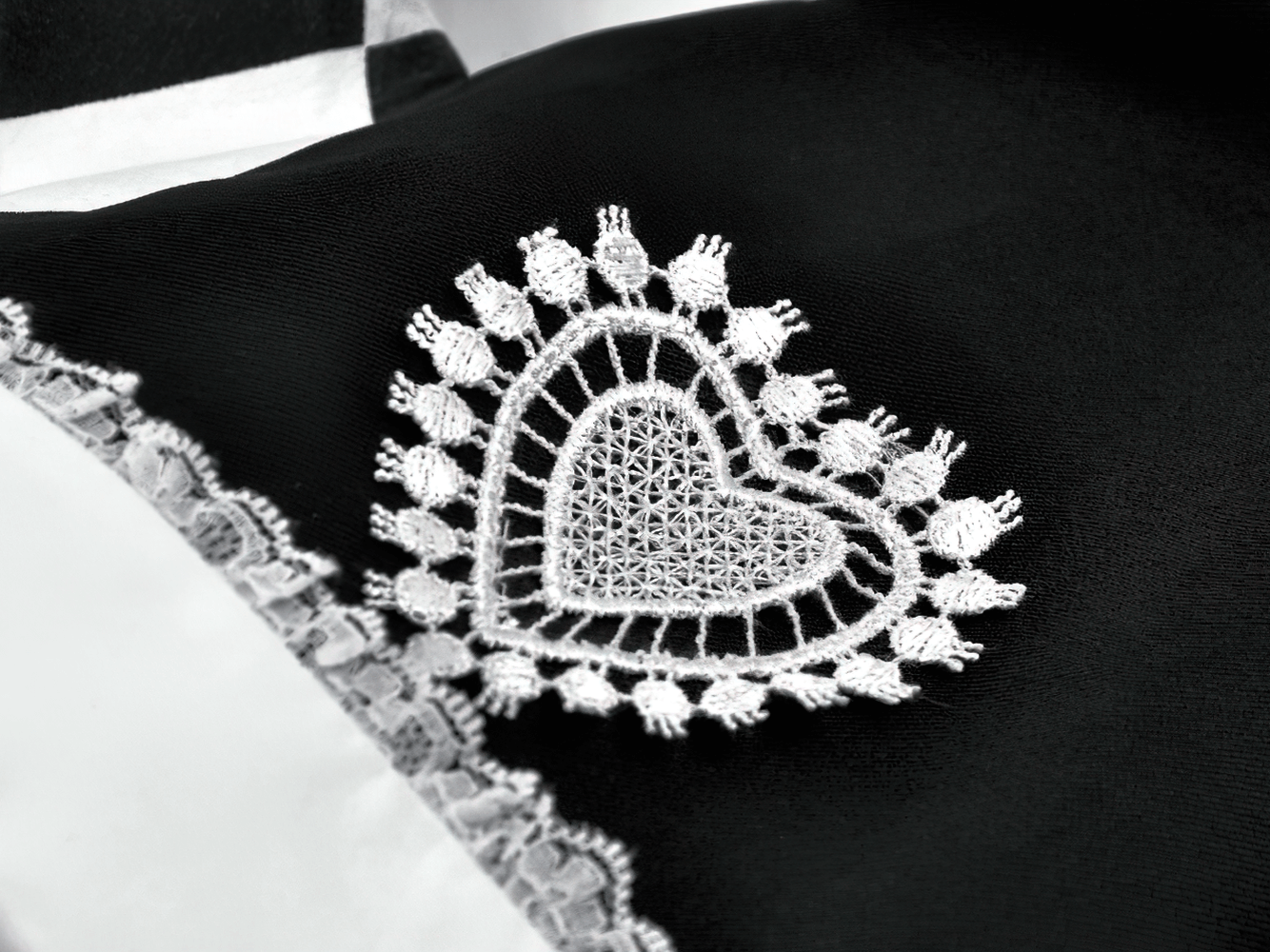 Black and White Harlequin Jester Hat with Lace Trim close-up showing intricate lace detail and heart design.