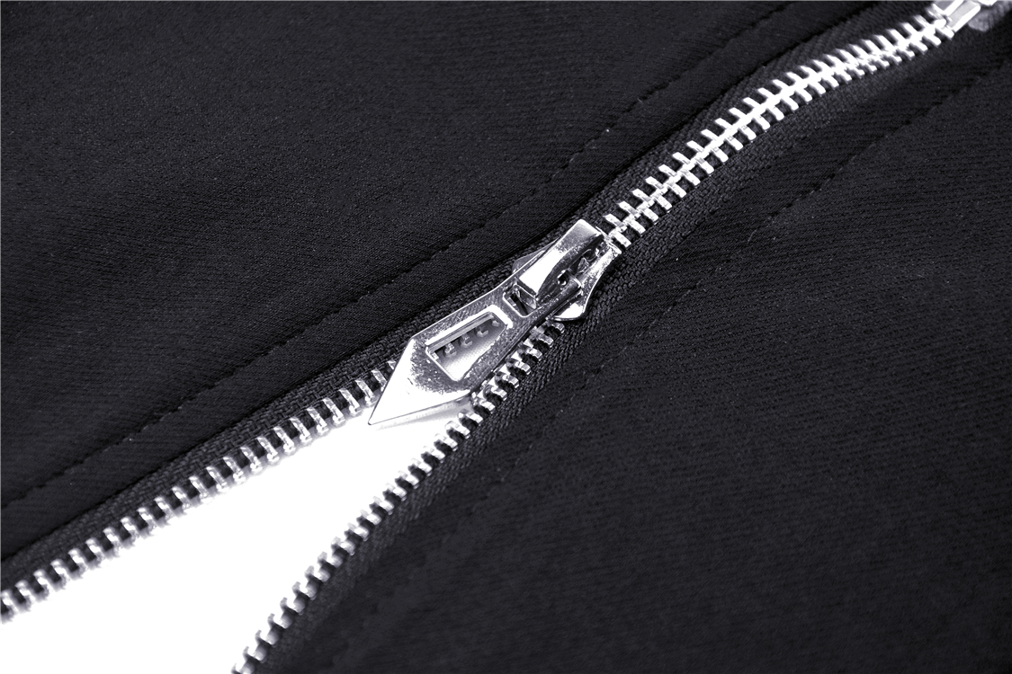 Close-up of a sleek black zipper with silver teeth, showcasing edgy fashion detail for punk style.