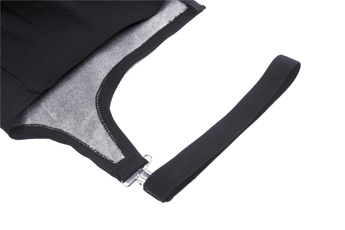 Close-up of black strap detail on a mini skirt featuring a zipper and leg loop for edgy punk style.