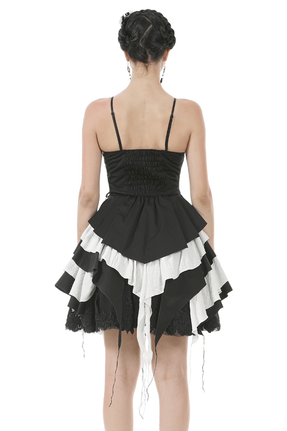 Back view of a black and white ruffled Gothic dress with lace, adjustable straps, and a statement bow.
