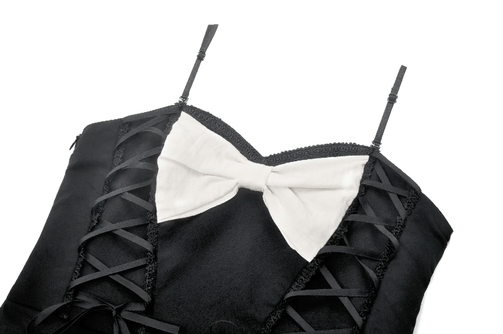 Close-up of a black and white Gothic dress featuring a corset top, lace detailing, and a chic bow accent.