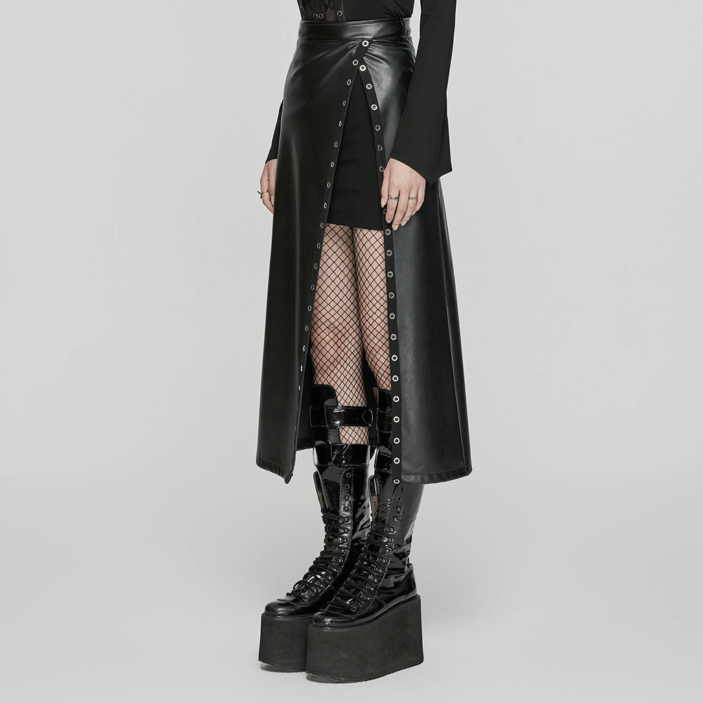 Black artificial leather maxi skirt with diagonal slit and metal eyelets, styled with edgy black platform boots.