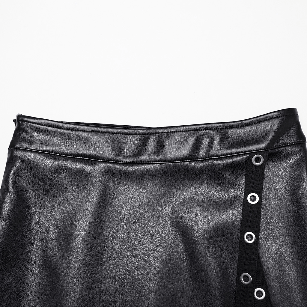 Close-up of a black artificial leather maxi skirt featuring metal eyelet details and a diagonal slit.