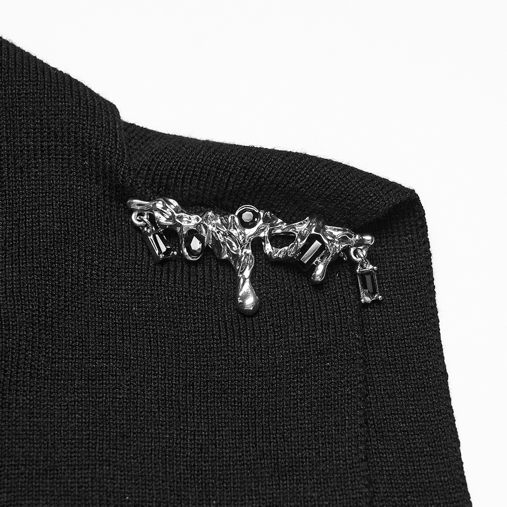 Detail of Black Asymmetric Knit Gothic Top with Metal Pins showcasing unique metallic embellishments.