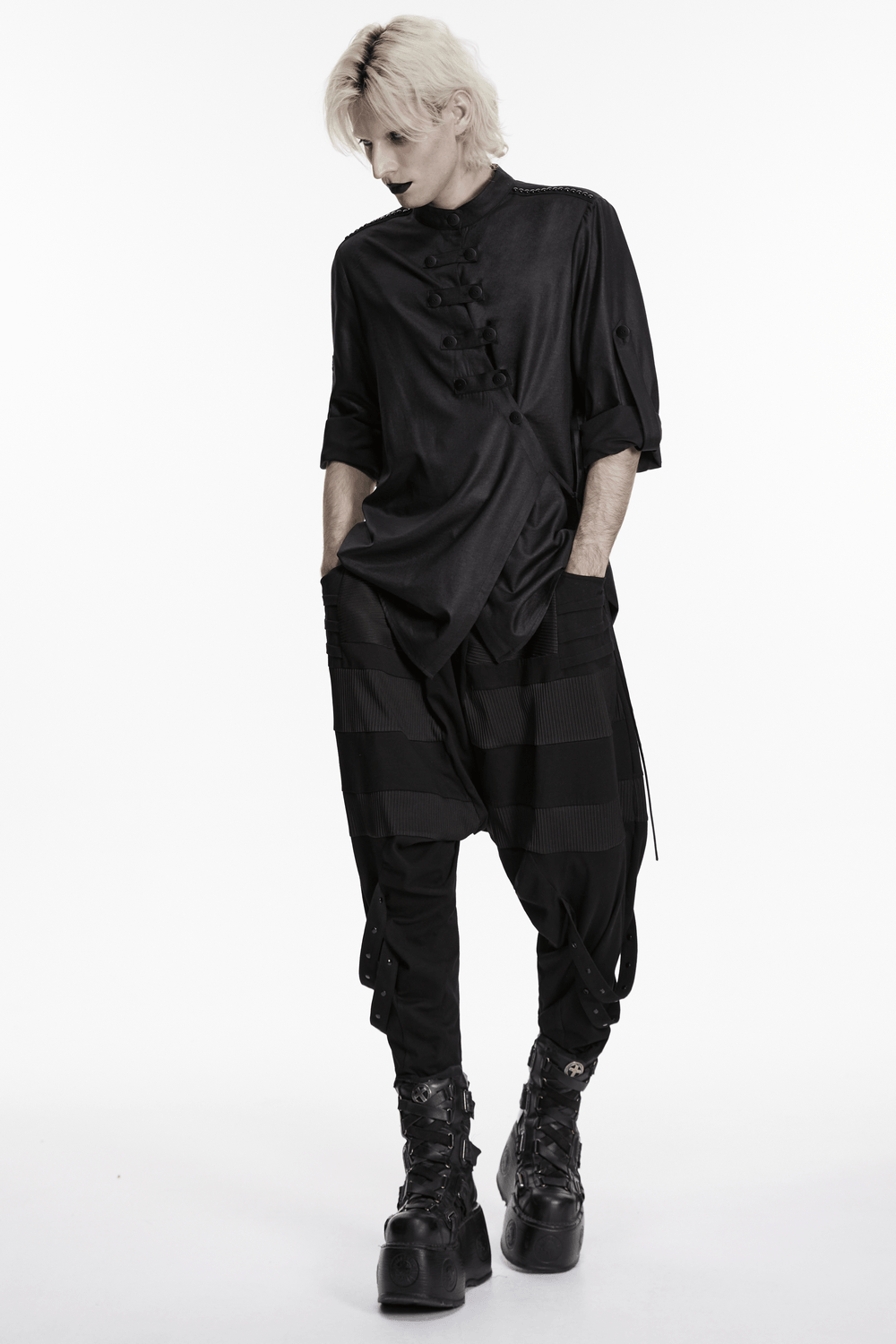 Black Asymmetric Punk Shirt with Hardware Straps worn with stylish dark pants and edgy boots, showcasing punk fashion.