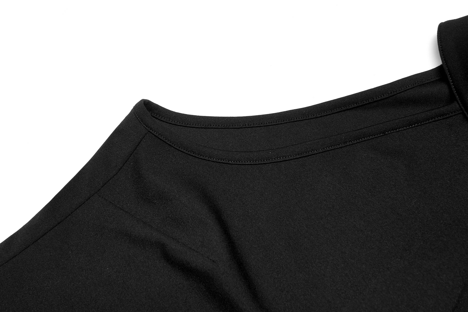 Close-up of the neckline of a black asymmetric dress, showcasing the sleek, stretchy fabric and minimalist design.