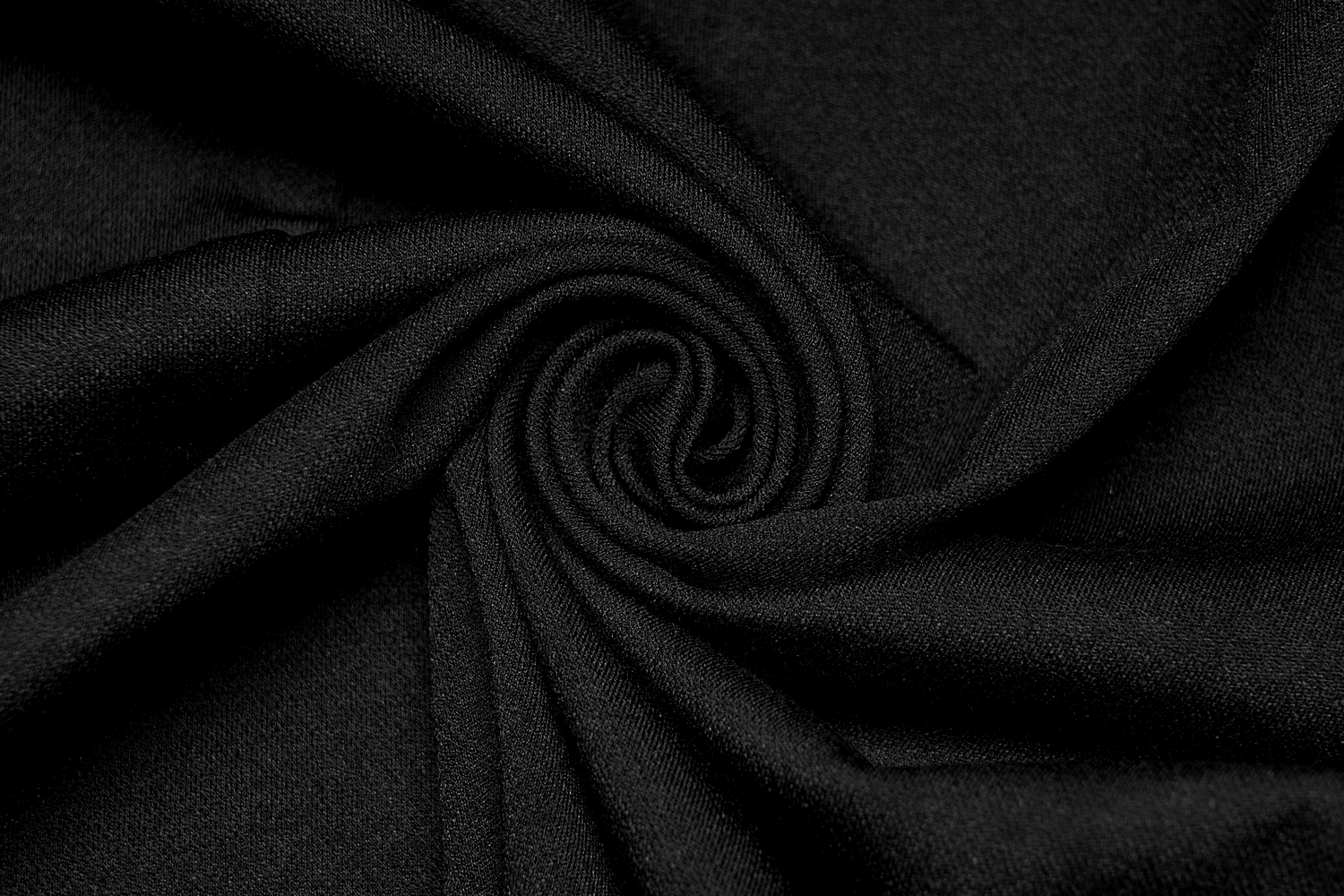 Black stretchy knitted fabric swirl perfect for creating edgy punk dresses.