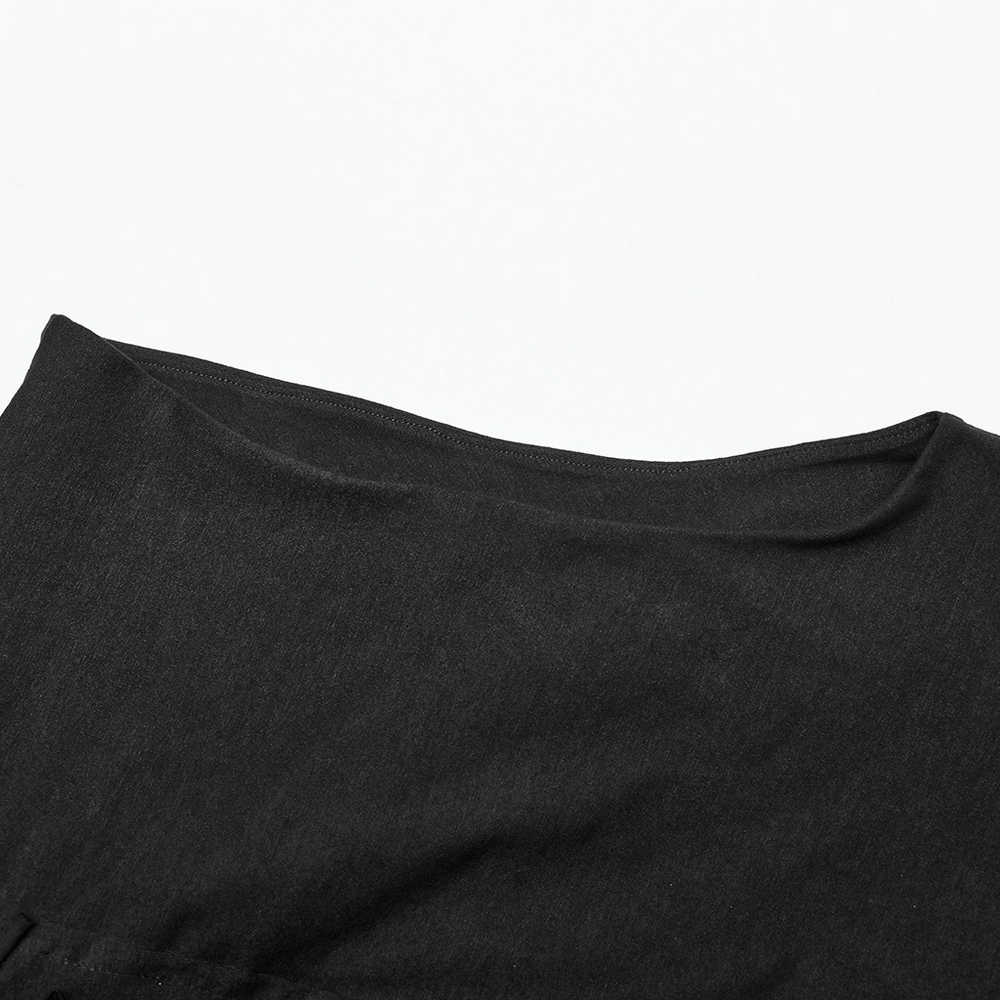 Close-up of the neckline of a black asymmetrical knit vest with a soft texture.