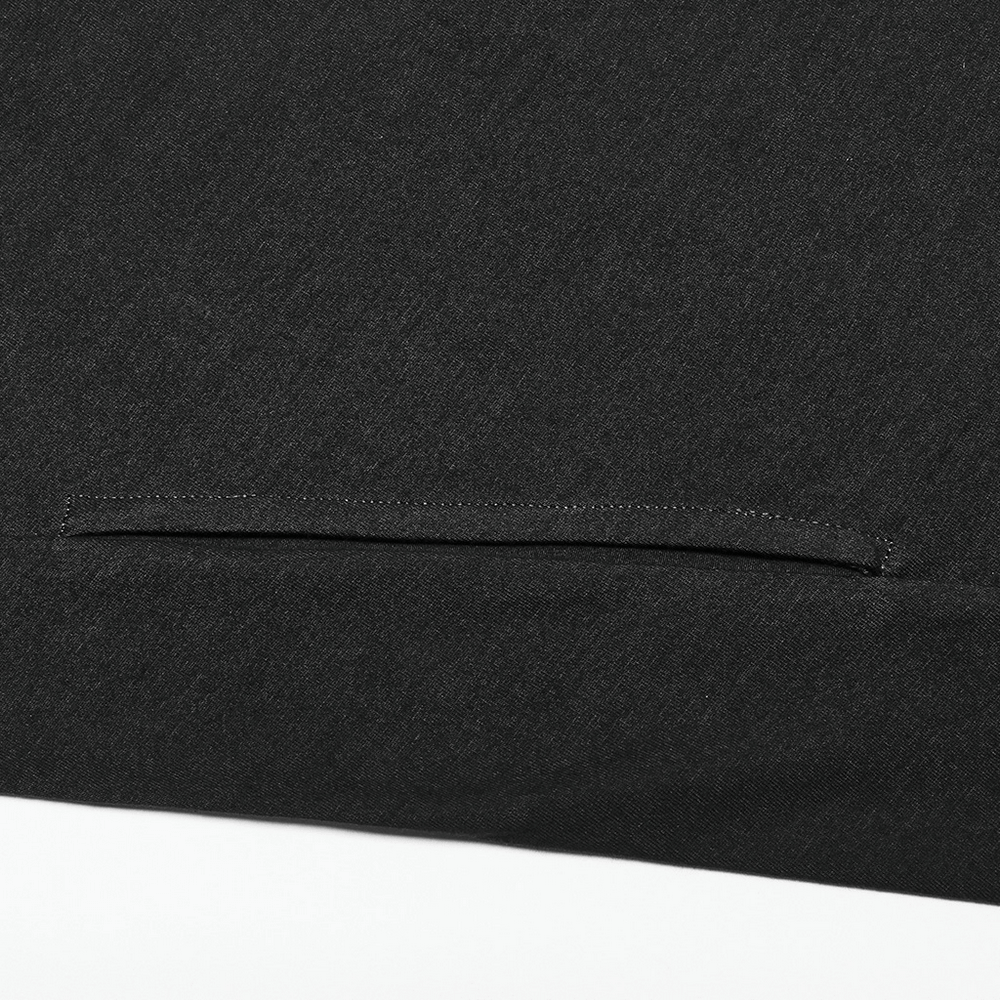 Close-up of the black fabric showcasing the sleek design and subtle detailing of the asymmetrical knit vest.