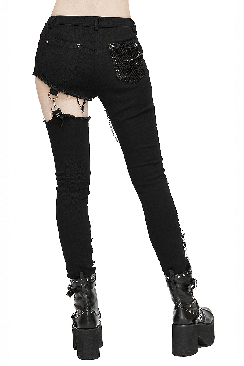 Gothic women's black asymmetrical skinny trousers with ripped details and silver accents.