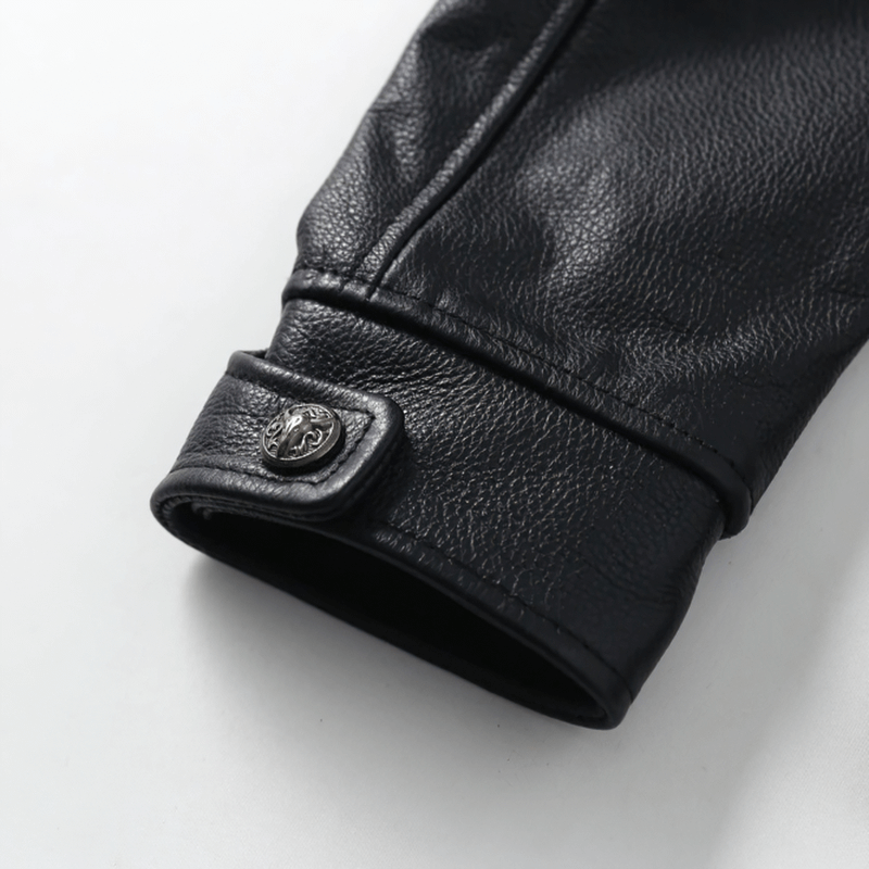 Close-up of the cuff detailing on a stylish black biker leather jacket for men.