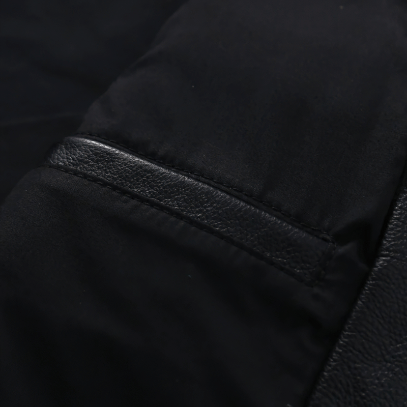Close-up of a pocket on a stylish black biker leather jacket for men, showcasing premium material and design.
