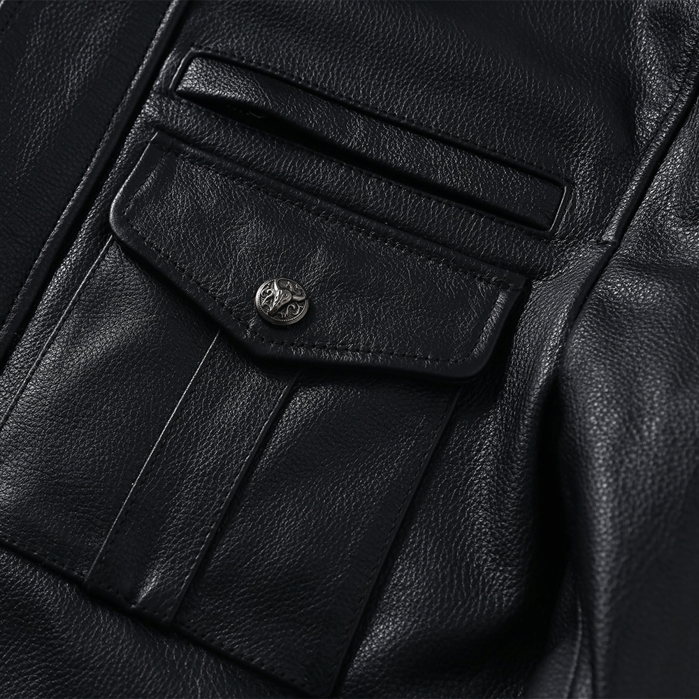 Close-up of the pocket on a black genuine leather biker jacket, showcasing stylish men's motorcycle clothing.