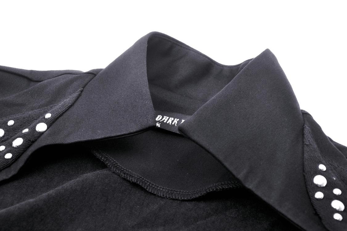 Close-up of a black bolero collar with bead embellishments, showcasing elegant evening wear details.