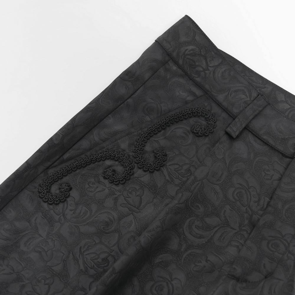 Close-up of black brocade gothic pants featuring unique embroidered details for a stylish look.