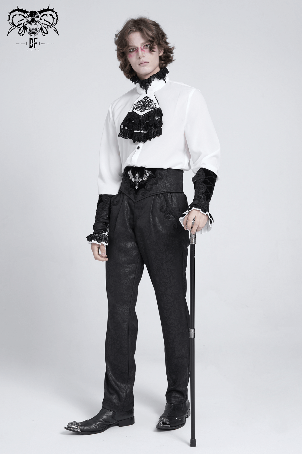 Black brocade gothic pants with embroidered details, styled elegantly with a white shirt and black accessories.