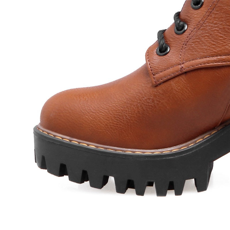 Close-up of brown women's lace-up ankle boot with rugged sole, perfect for stylish comfort in autumn.