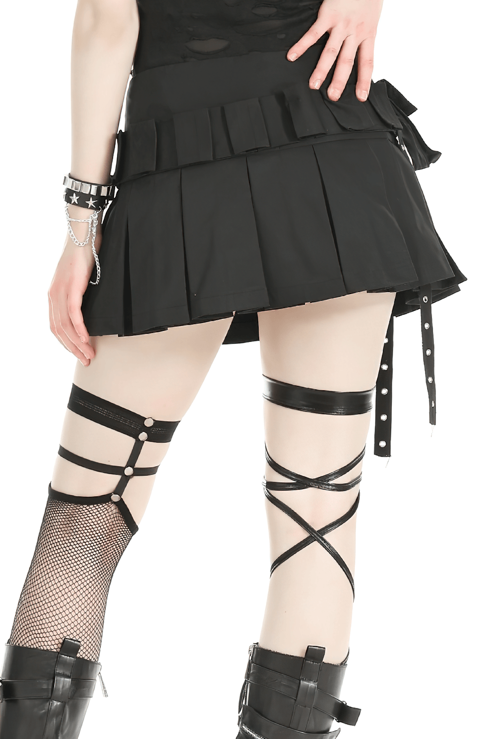 Edgy black pleated mini skirt with buckle accents and side zipper, perfect for bold fashion statements.