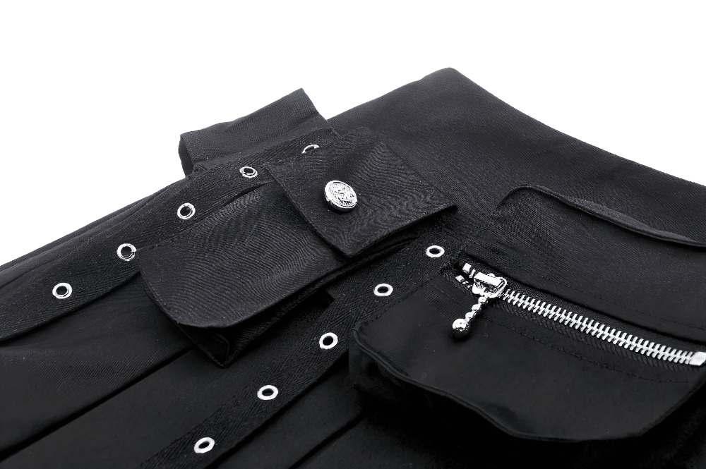 Edgy black mini skirt with buckle accents and side zipper detail, showcasing sharp pleats and stylish design.